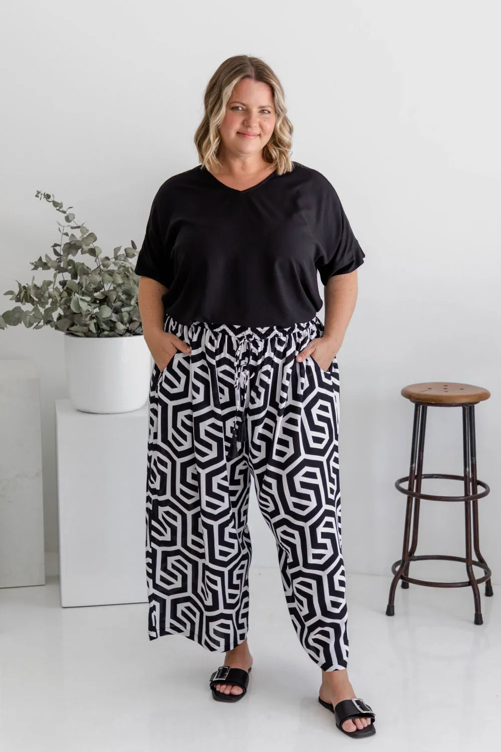 Chic Simplicity: Black Blouse and Black & White Geo Wide Leg Pants