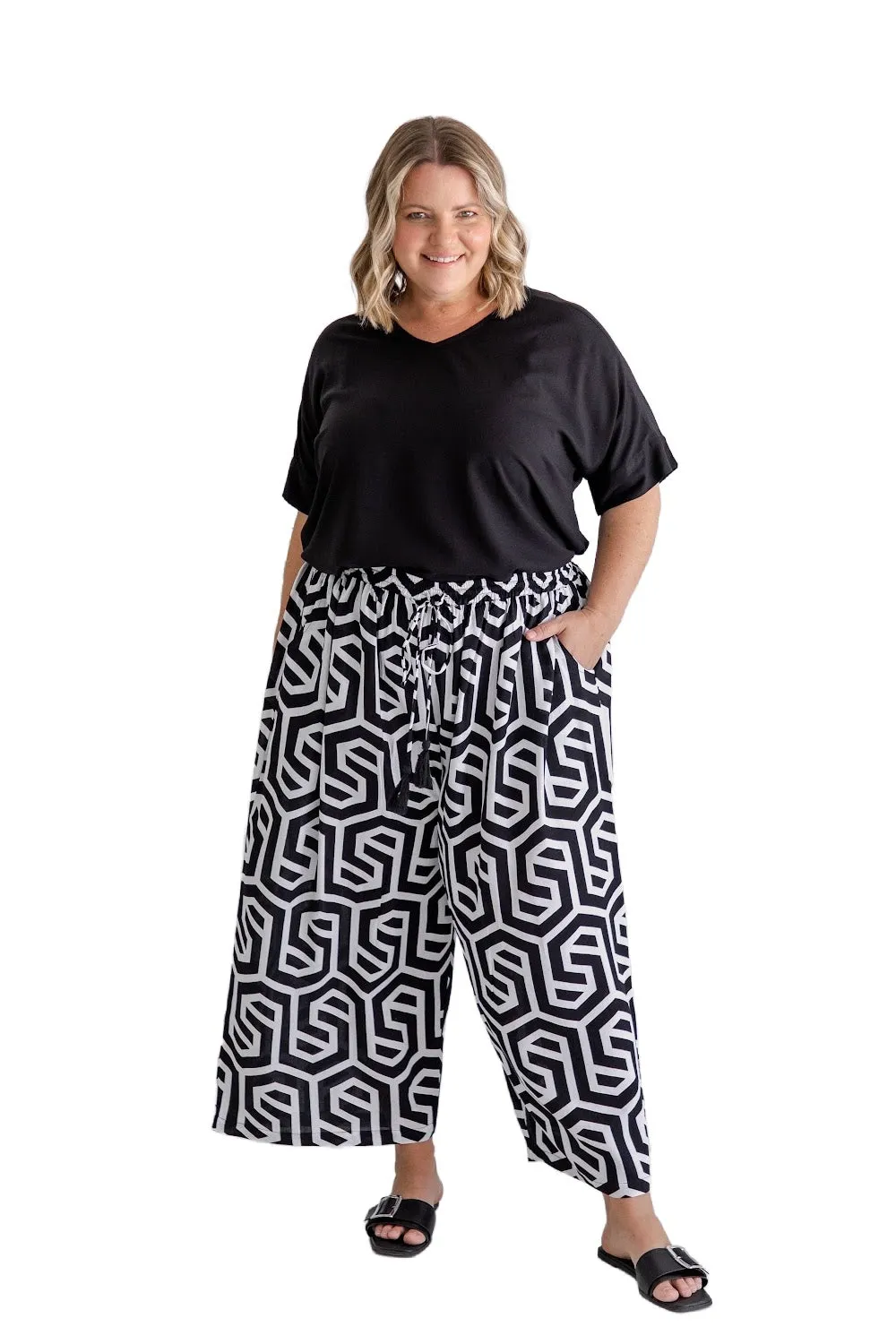 Chic Simplicity: Black Blouse and Black & White Geo Wide Leg Pants